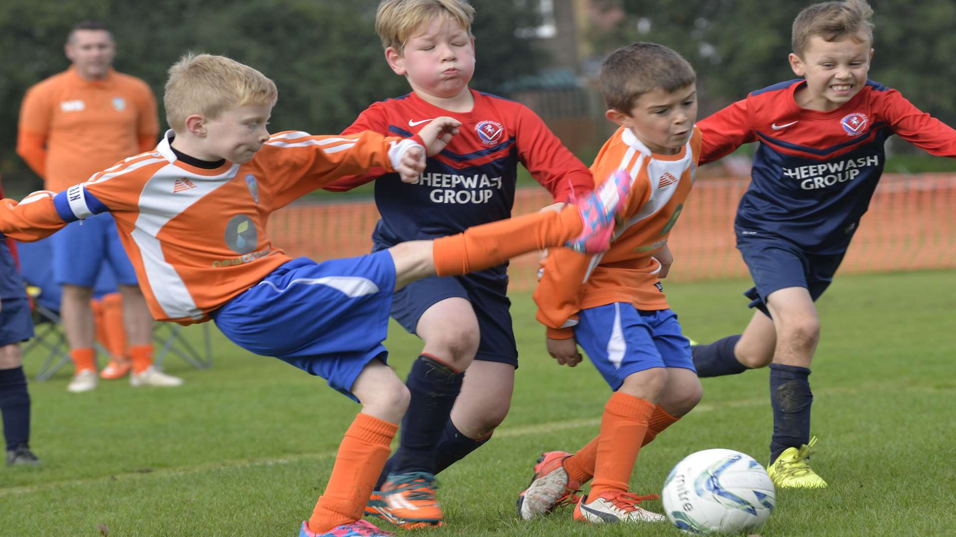 Cuxton Warriors under-8s (orange) and Hempstead Valley Hawks under-8s battle for the ball Picture: Ruth Cuerden