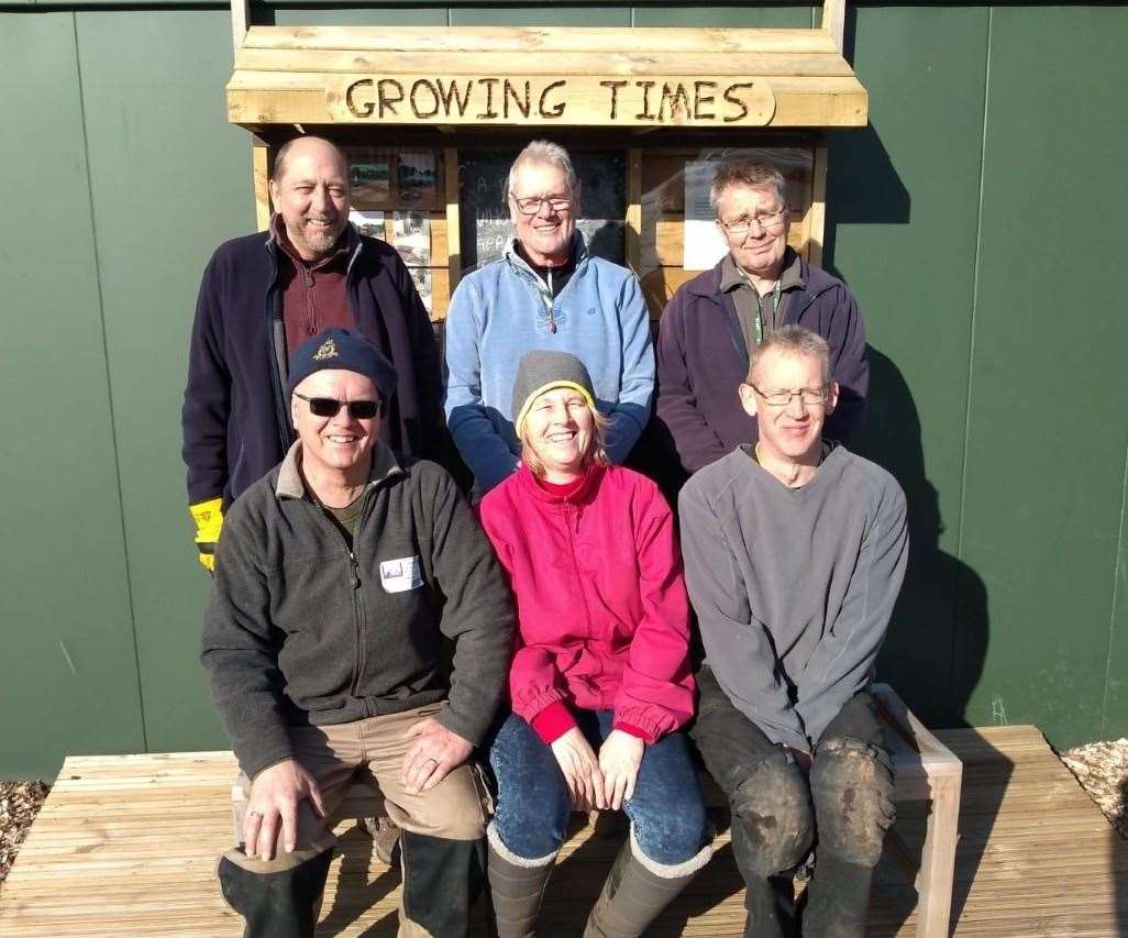 Any Diprose, (front right), with head of horticulture Paul Atkinson (back right) and volunteers at the school