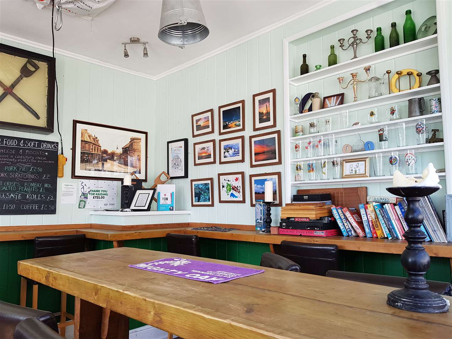 Inside the Four Candles - with the 'fork handles' framed on the wall and 'Os' and 'Ps' on the shelves