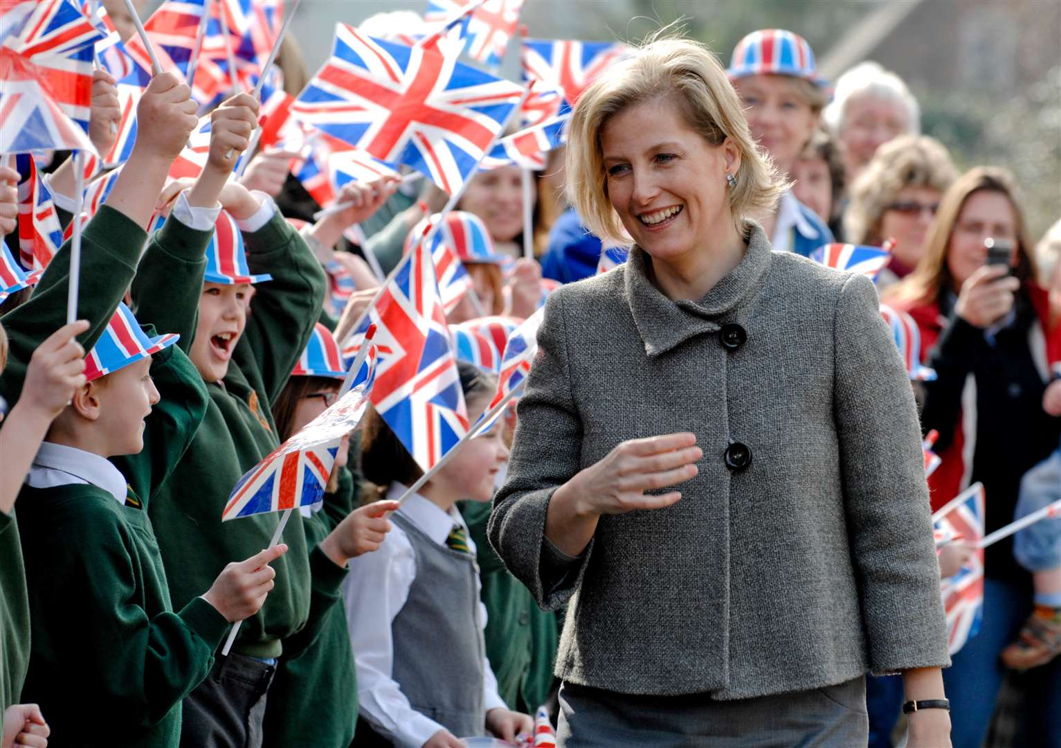 Sophie is greeted by the youngsters from Horsmonden Primary School during a visit in 2009. Picture: Matthew Walker