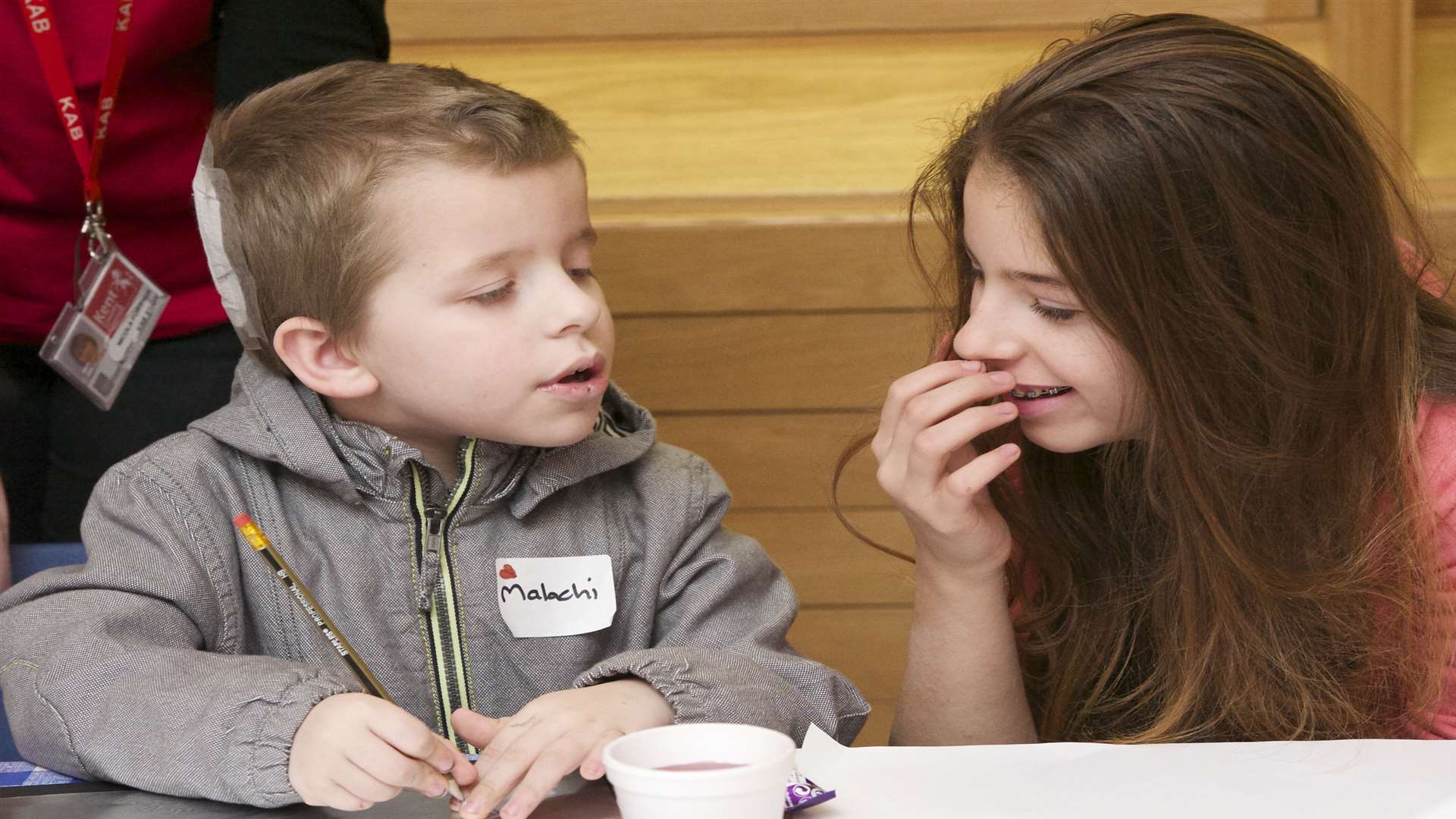 Malachi, 7, with his sister Ayesha, 11, creating a foil metal based on the musuem's military medals.