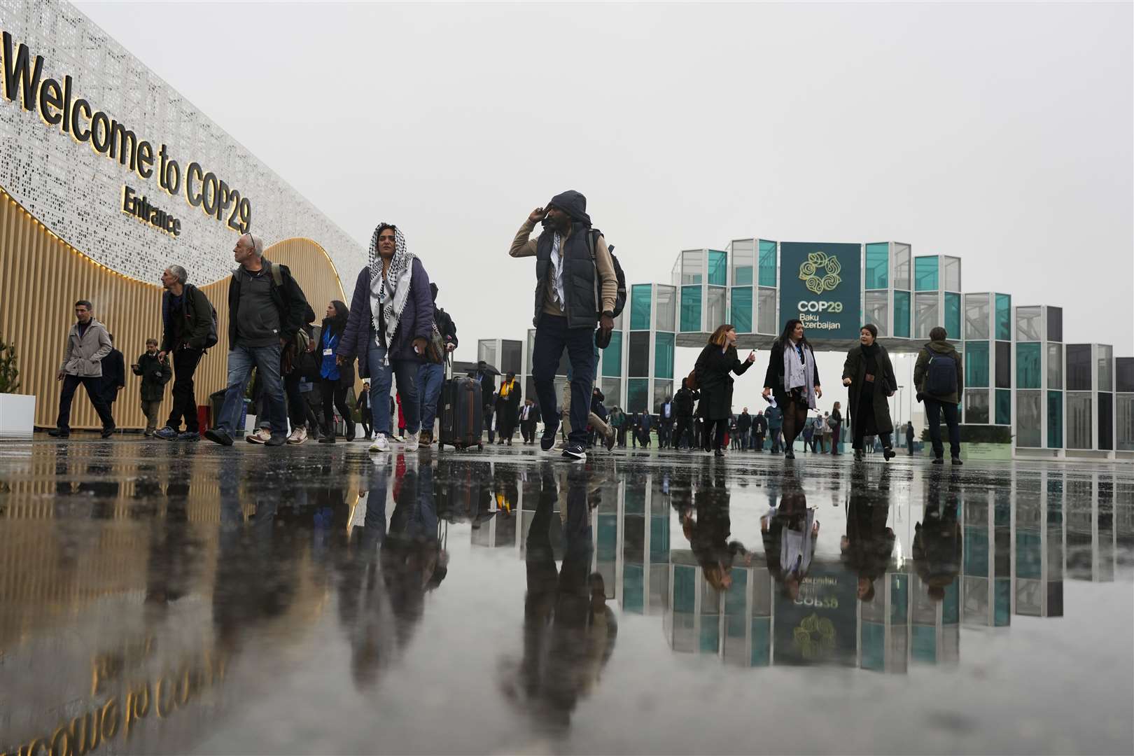 People arriving at the venue for Cop29 in Baku, Azerbaijan (AP Photo/Rafiq Maqbool)