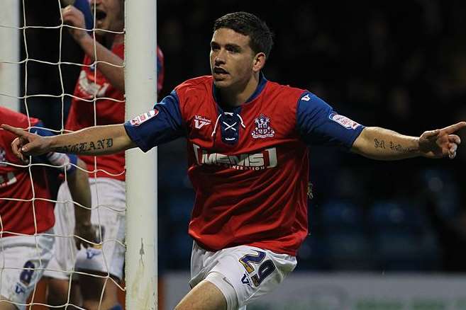 Cody McDonald celebrates scoring for Gillingham