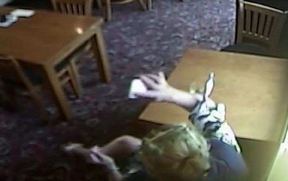 CCTV showed the moment Stephanie Langley smashed a phone on a table in the Hare and Hounds