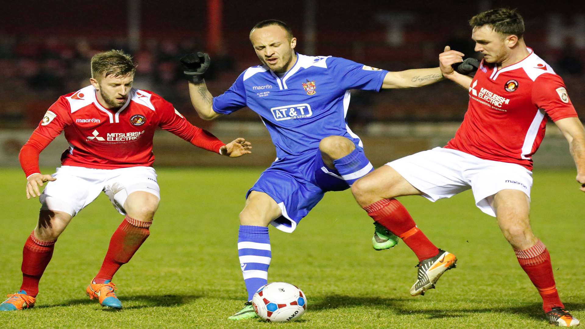 Dean Pooley and Matt Johnson challenge Staines striker Elliott Buchanan Picture: Matthew Walker