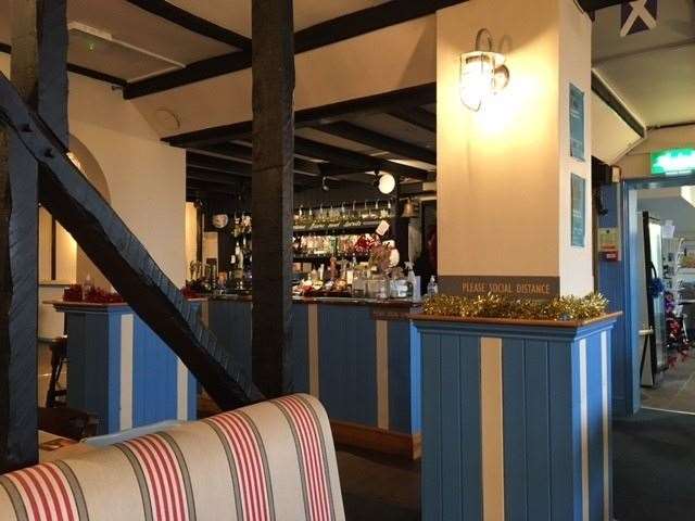 Painted blue and white inside, with the furniture covered in striped material, there is something of a beach hut look to The Britannia