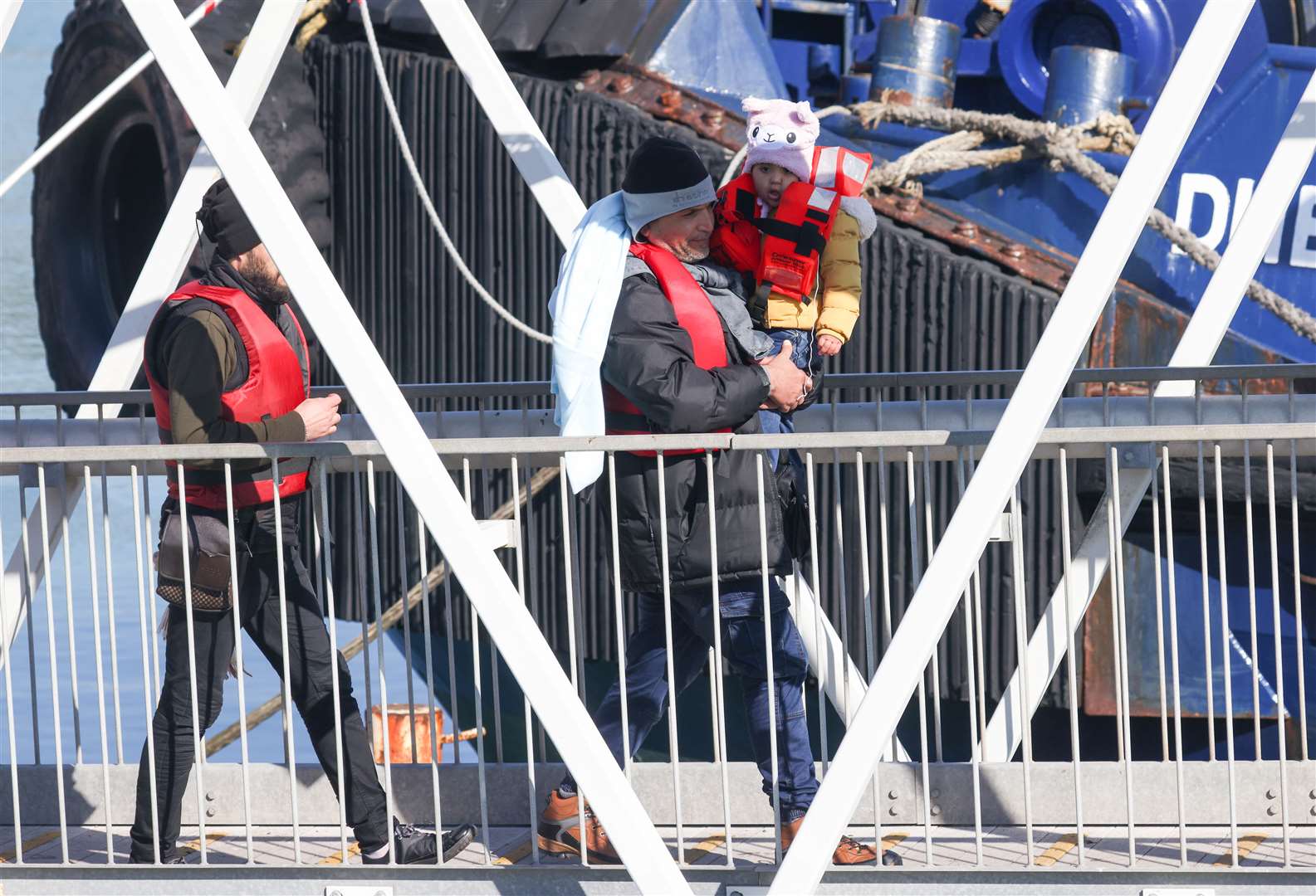 A young child in a woolly hat is among the hundreds of people reported to have crossed the Channel today. Picture: UKNIP