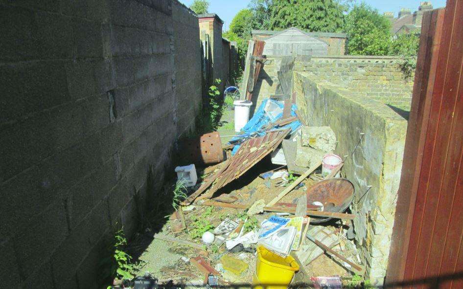 Before: the rubbish piled up in the alley