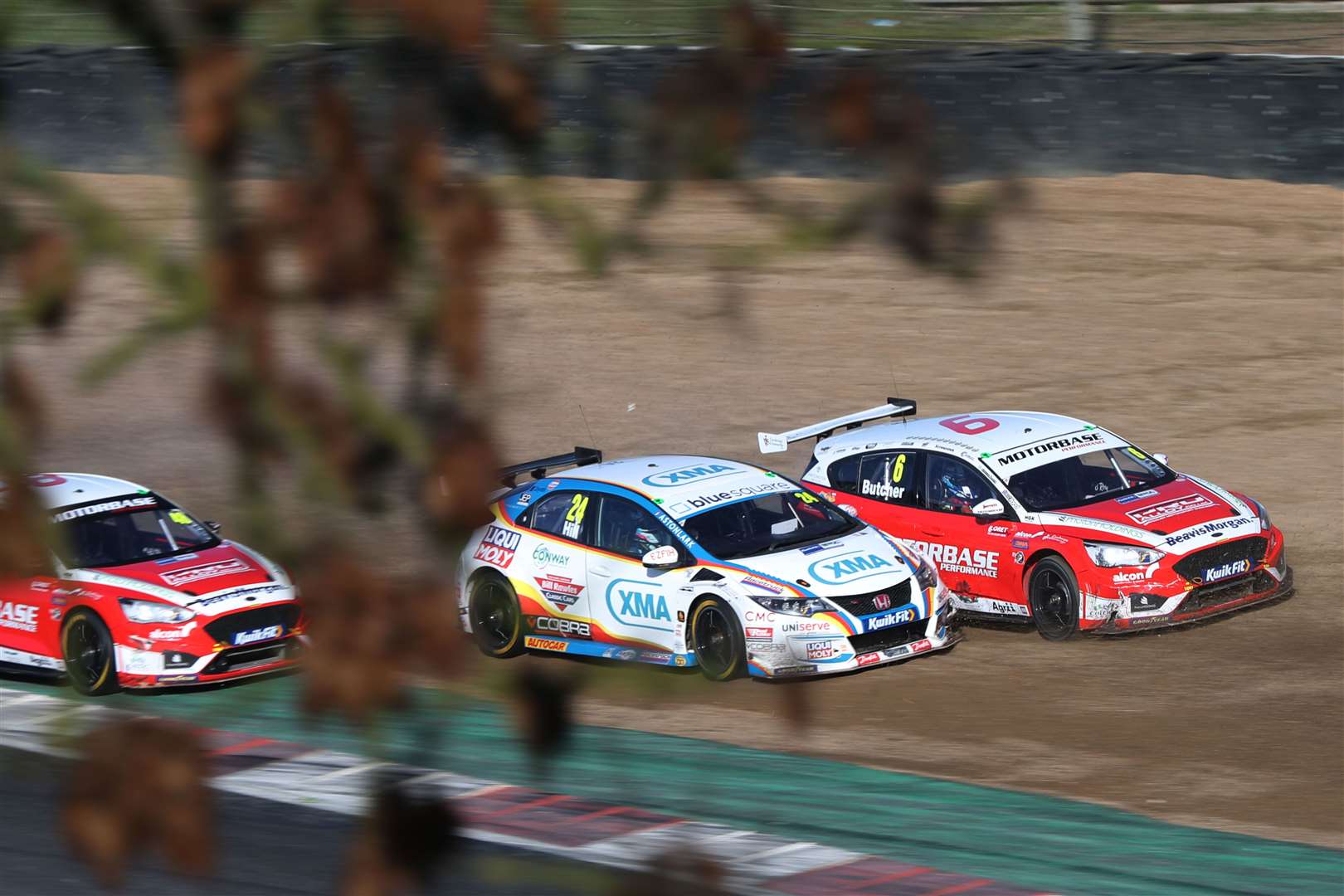 A moment in the gravel for Rory Butcher before going onto claim a race win Picture: BTCC/Jakob Ebrey (43132510)