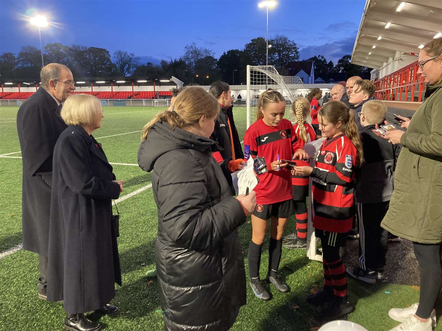 Gillingham Women signing autographs after their first match back at Chatham on Sunday