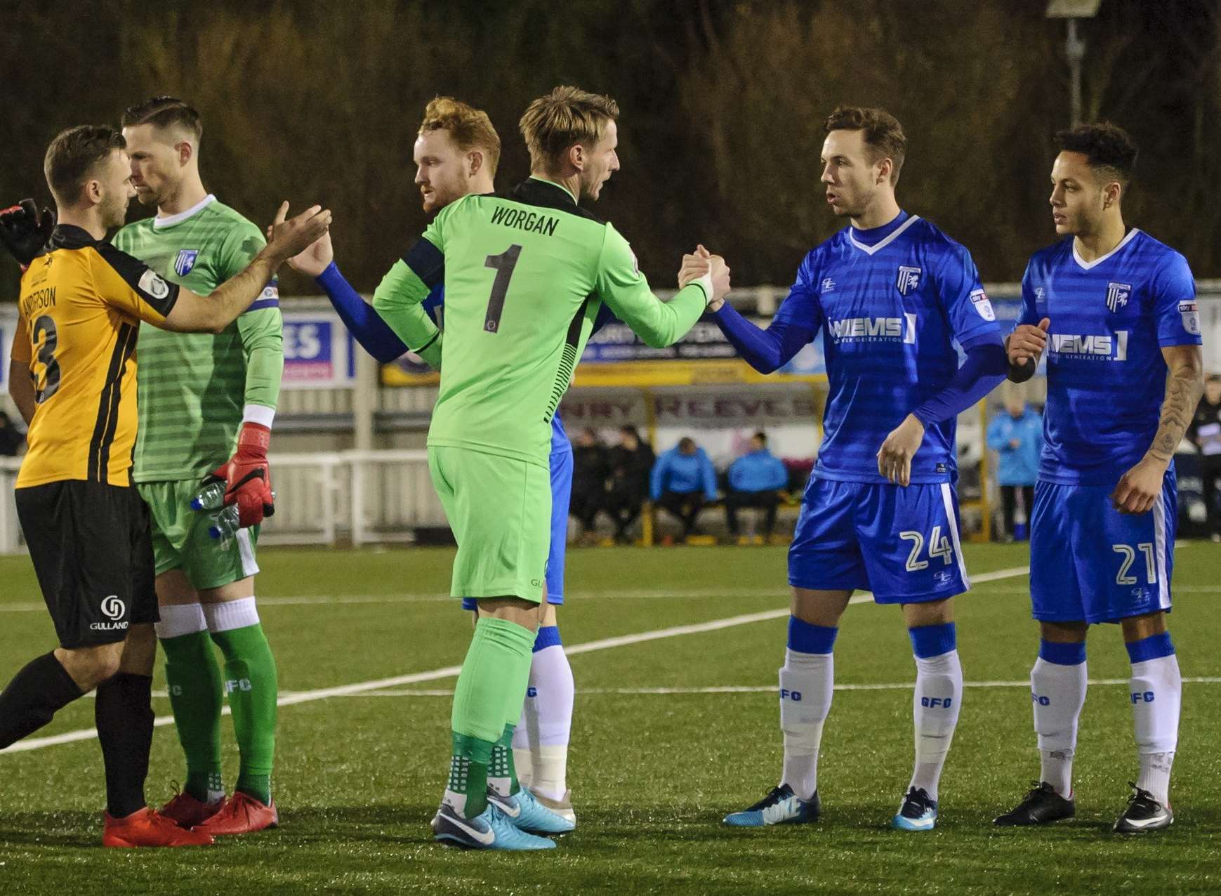 Maidstone keeper Lee Worgan leads the home side's pre-match handshake with the Gills Picture: Andy Payton