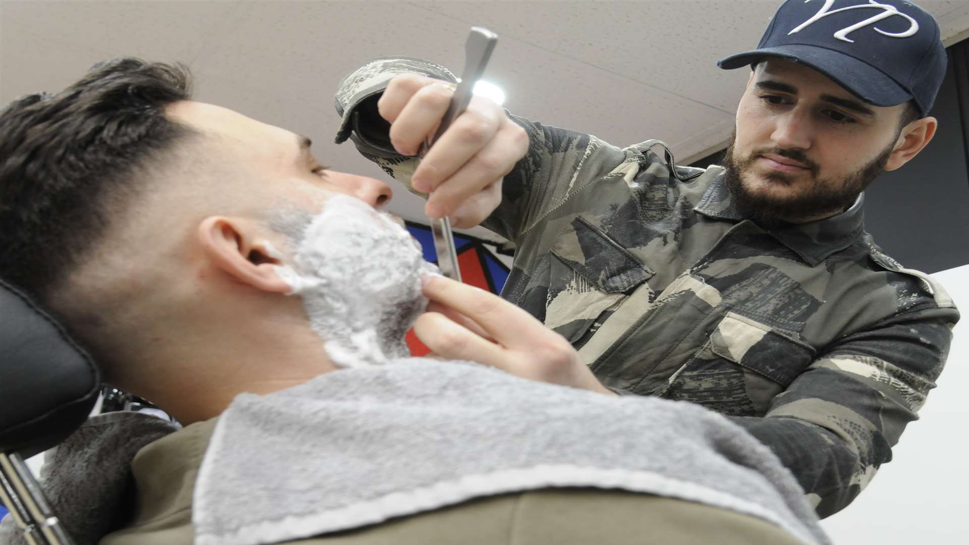 Barber Salih Saruhan who has been nominated for best wet shave in the UK