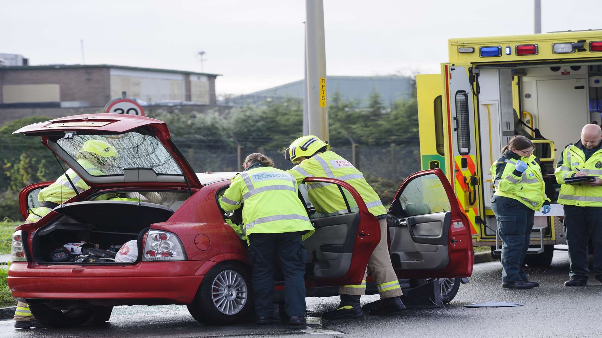 Firefighters preparing to remove roof. Emergency services at the scene of an incident on the A228. at the roundabout junction of Peninsula Way, Dux Court Road and Bell Lane.