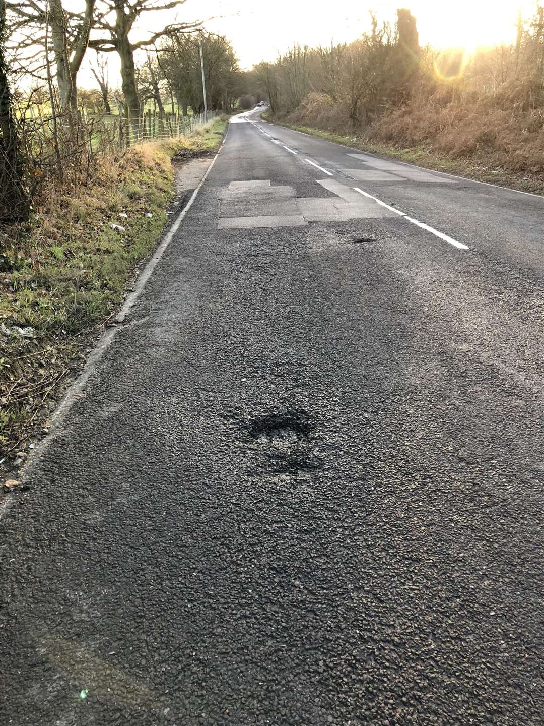 The car was wedged against a tree in Halfpence Lane, Cobham, near Gravesend