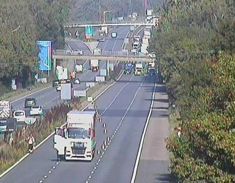 A lorry has broken down in the middle of the coastbound carriageway just after Junction 9