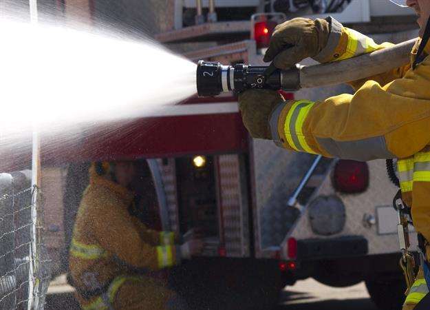 Fire crew are at Bell Farm Lane, Minster. Stock image