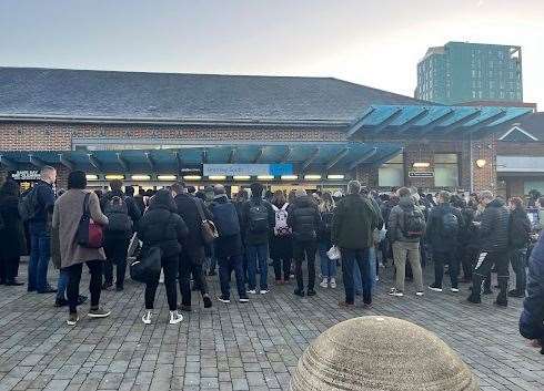 Crowd huddling outside Bromley South Station