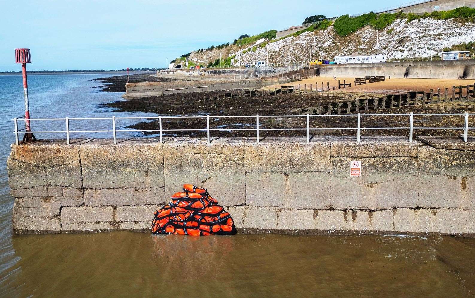 A painting of lifejackets on a sea wall in Ramsgate, to draw attention to those who lose their lives crossing the English Channel Picture: Content Cover Media/Matthew Richardson