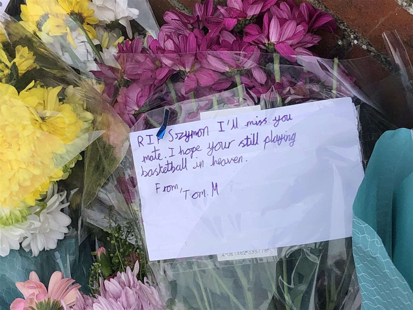 Floral, candle and basketball tributes have been laid in Vale Road