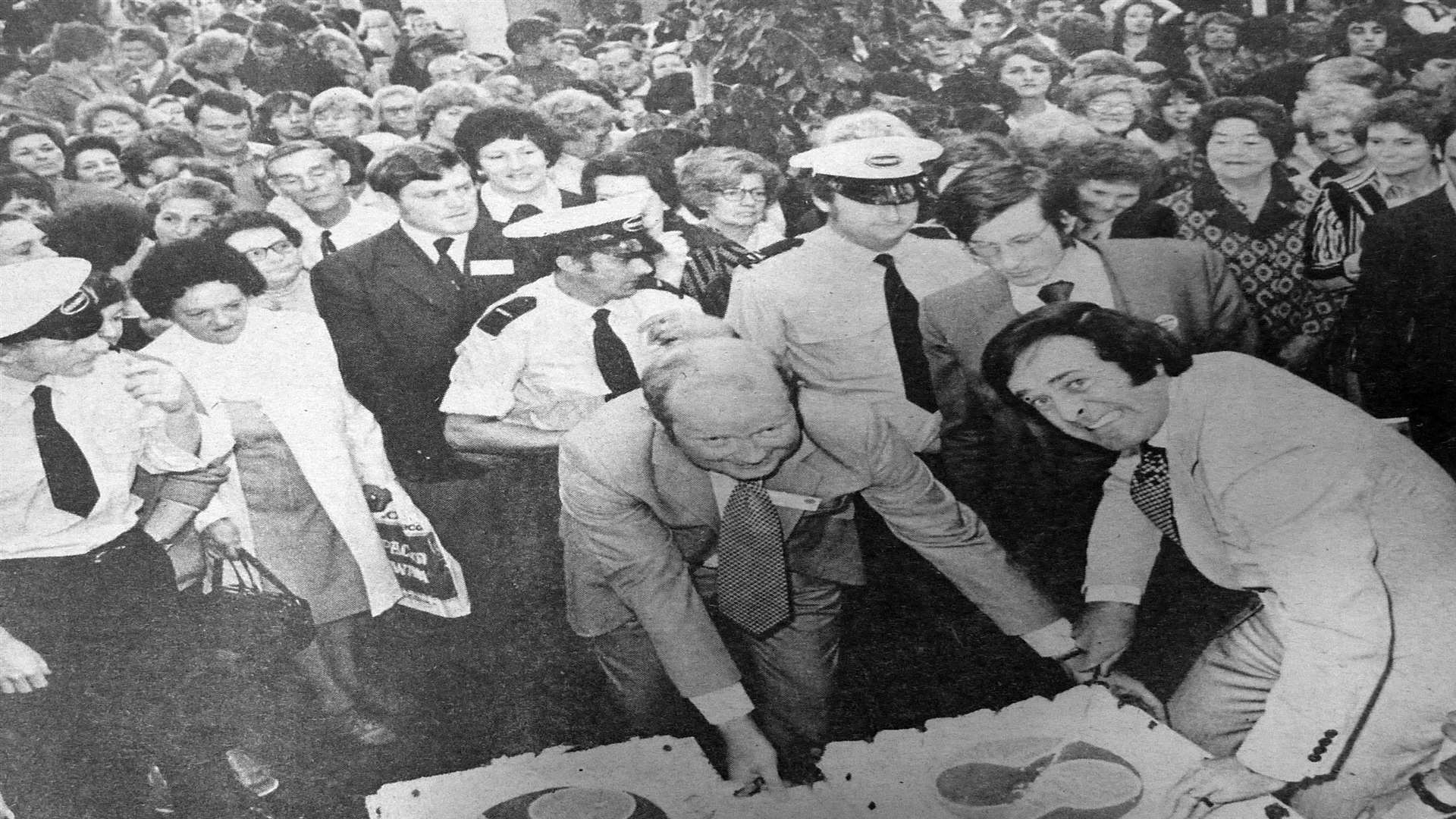 Terry Wogan cutting the SavaCentre's first birthday cake