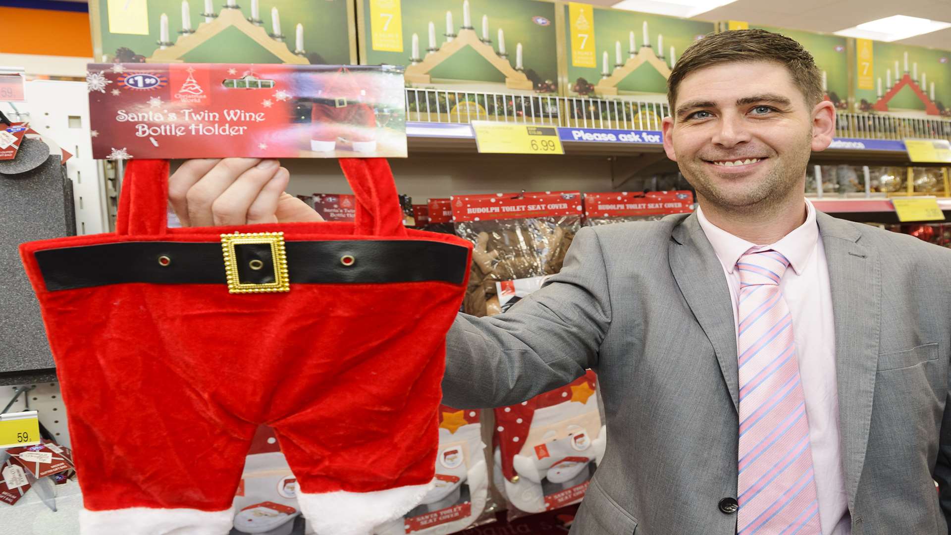 Manager Carl Russell, with last year's best-seling Christmas item, a novelty wine bottle holder.