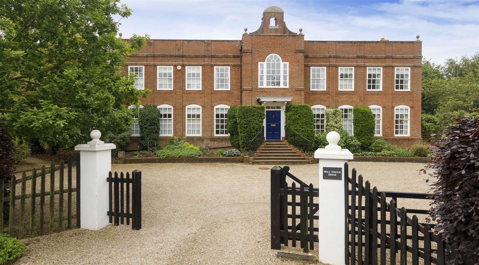 The Georgian-style house is crowned by a bell tower