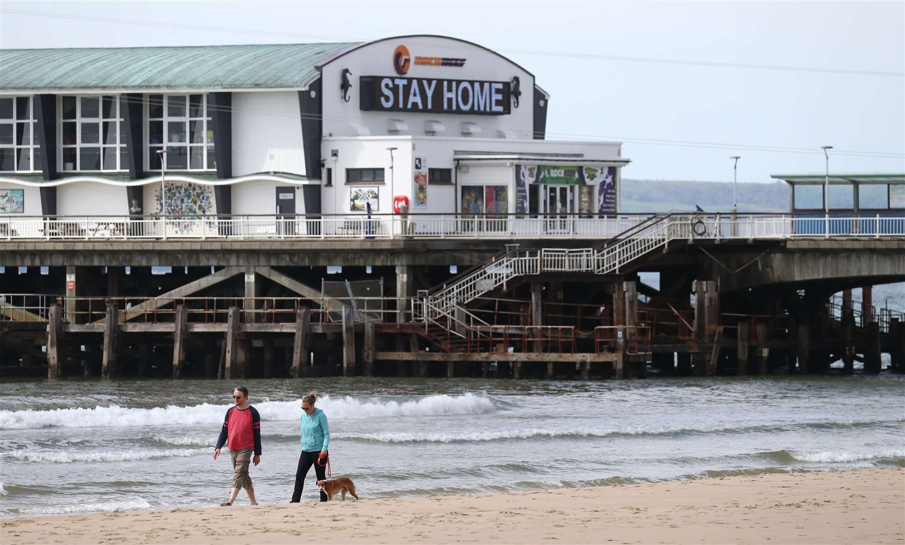 Just a few dog walkers were seen on the sands, which can often be packed at this time of year (Andrew Matthews/PA)