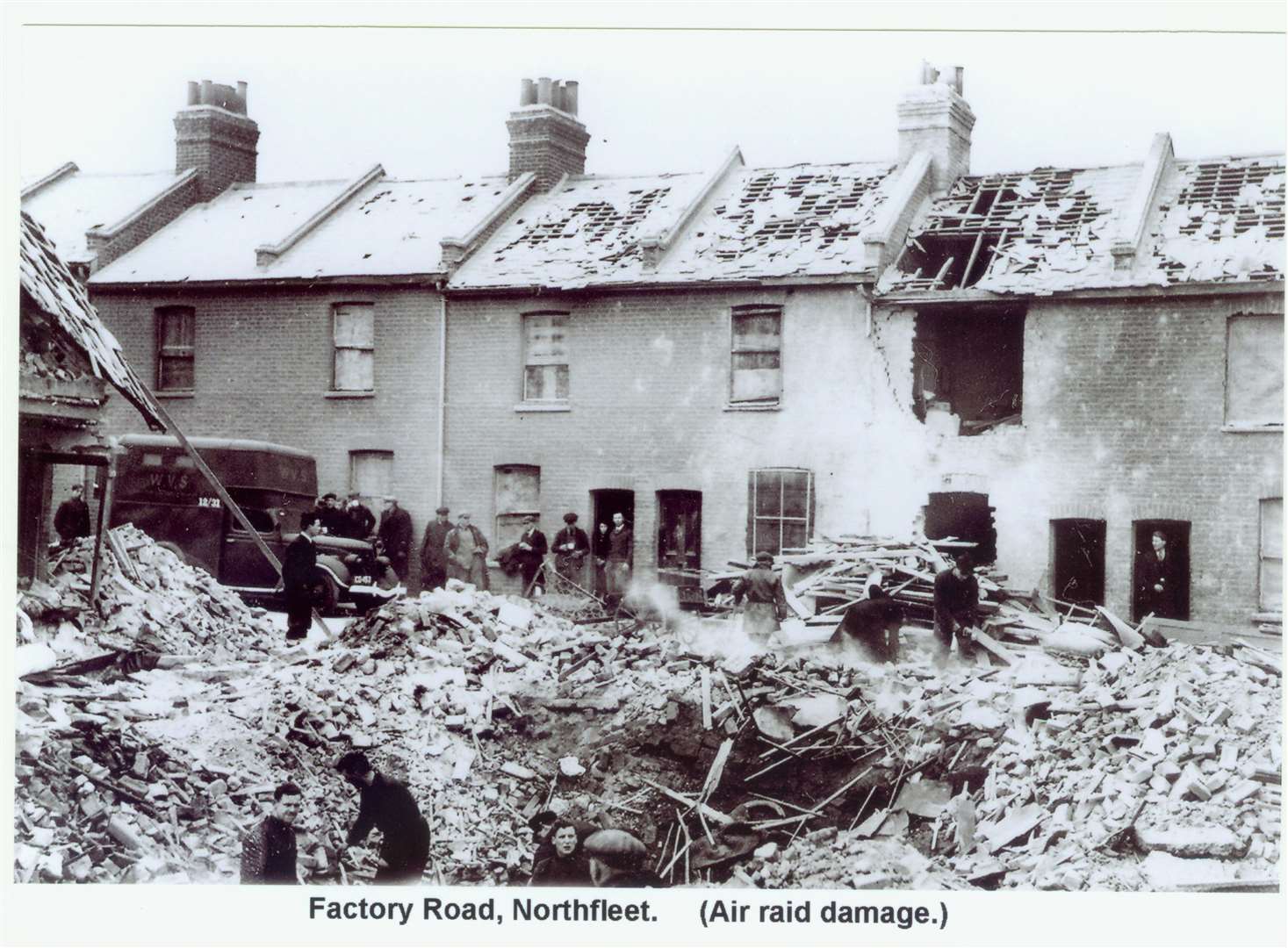 Factory Road, Northfleet after an air raid during the war. In the doorway on the very left stands Fanny Harden, mother of war hero Henry "Eric" Harden. Picture: Gravesend Library (6705054)