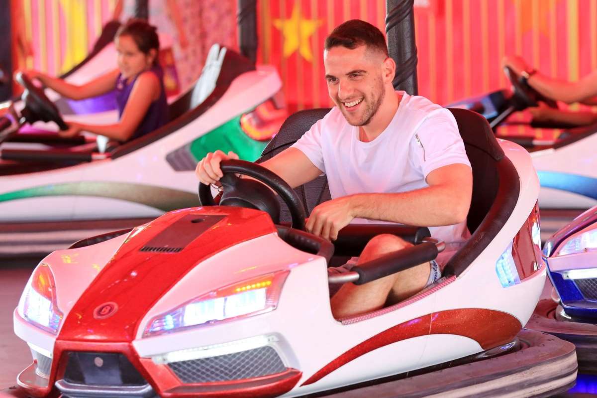 Have a fantastic time on the funfair rides, like this guy