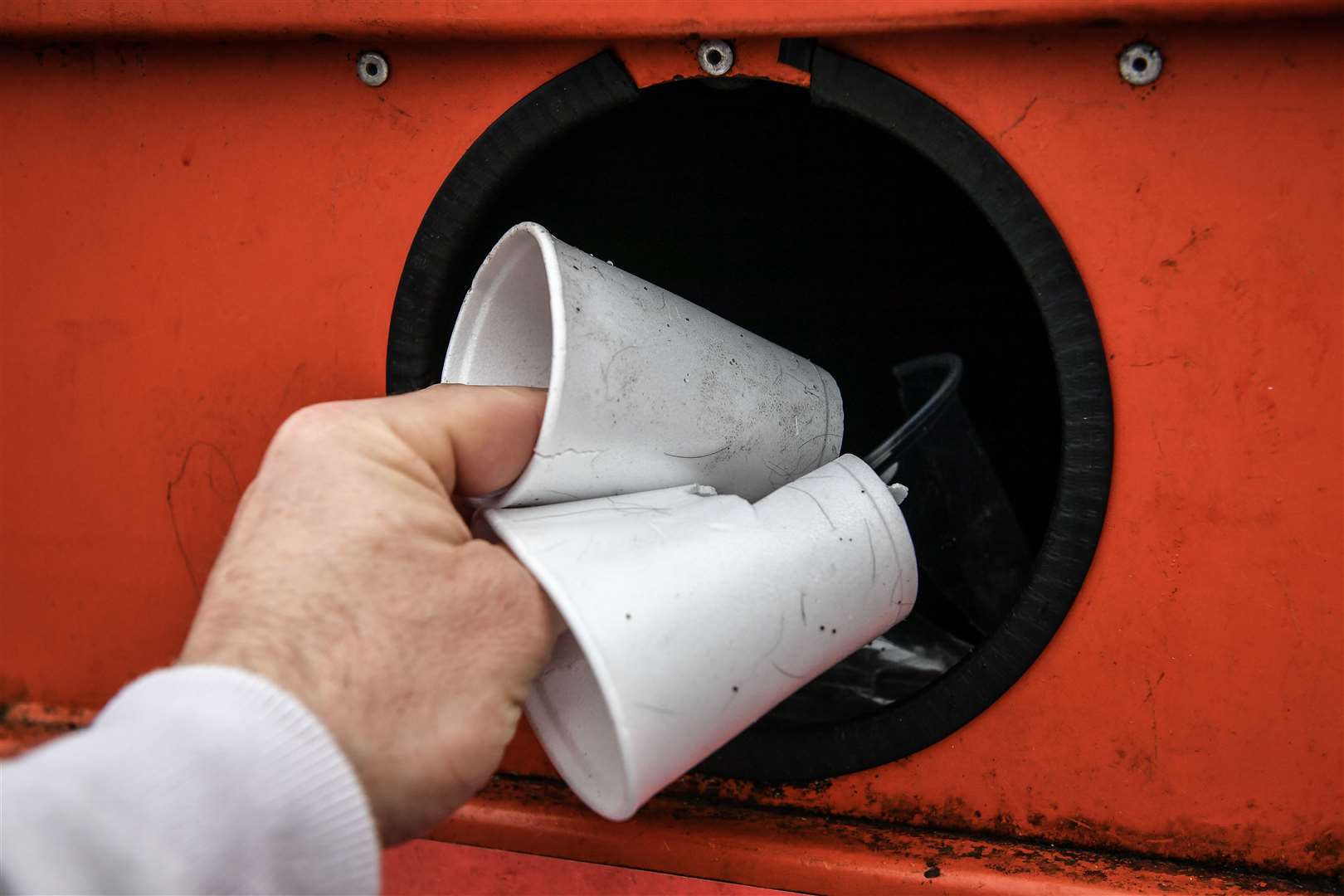 Disposable drinking cups are deposited at a plastic recycling centre (Ben Birchall/PA)