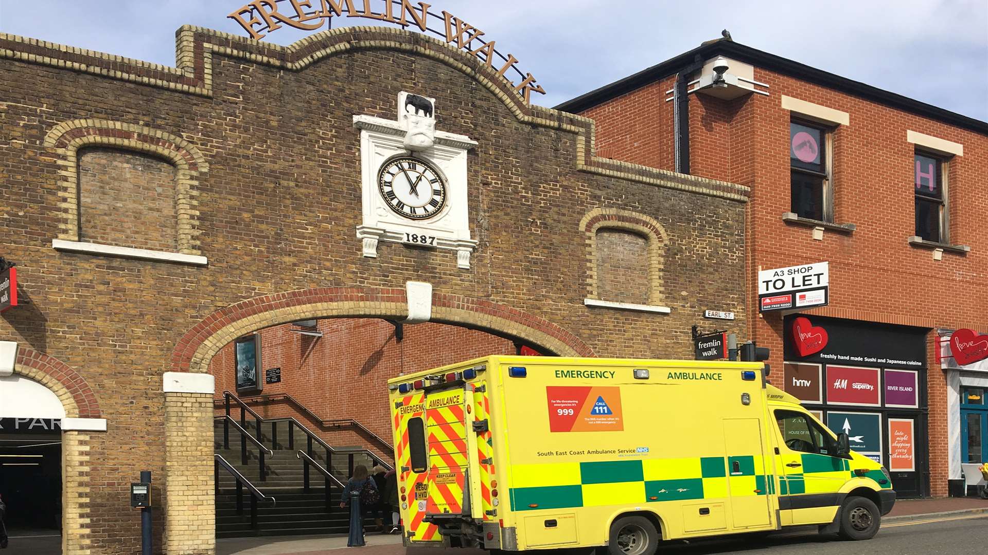 An ambulance is currently outside Fremlin Walk on Earl Street.