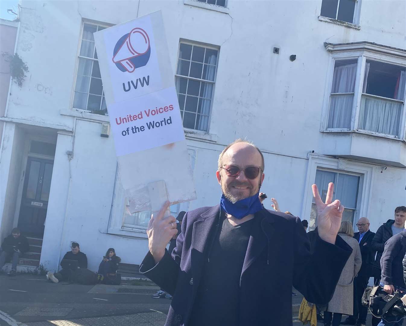 A man holds a banner at today's march