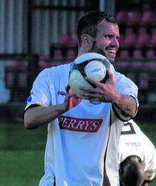 Hat-trick hero Adam Birchall shows off the match-ball to Whites fans