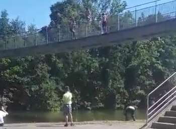 Groups of youngsters can be seen on the bridge