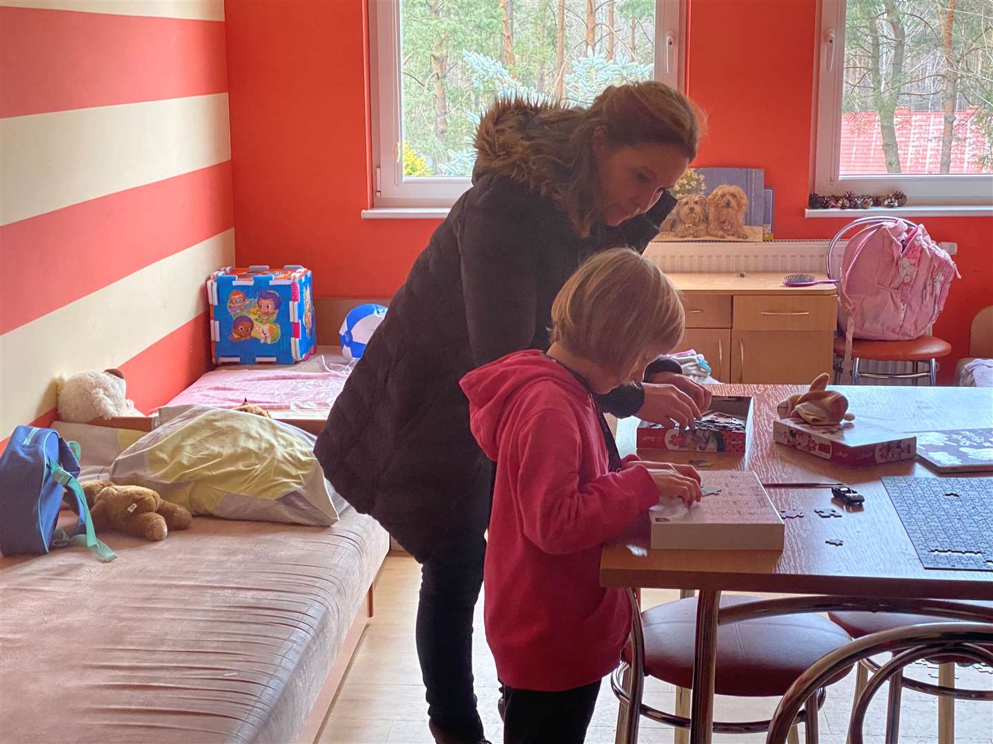 Deal and Dover MP Natalie Elphicke with a refugee inside the orphanage which has been set up at a holiday park