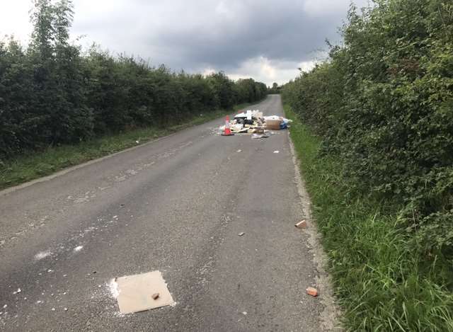 Dumped debris closes country lane