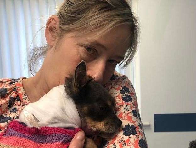 Tessa cuddling Evie at the vets. Picture: Tessa Burr