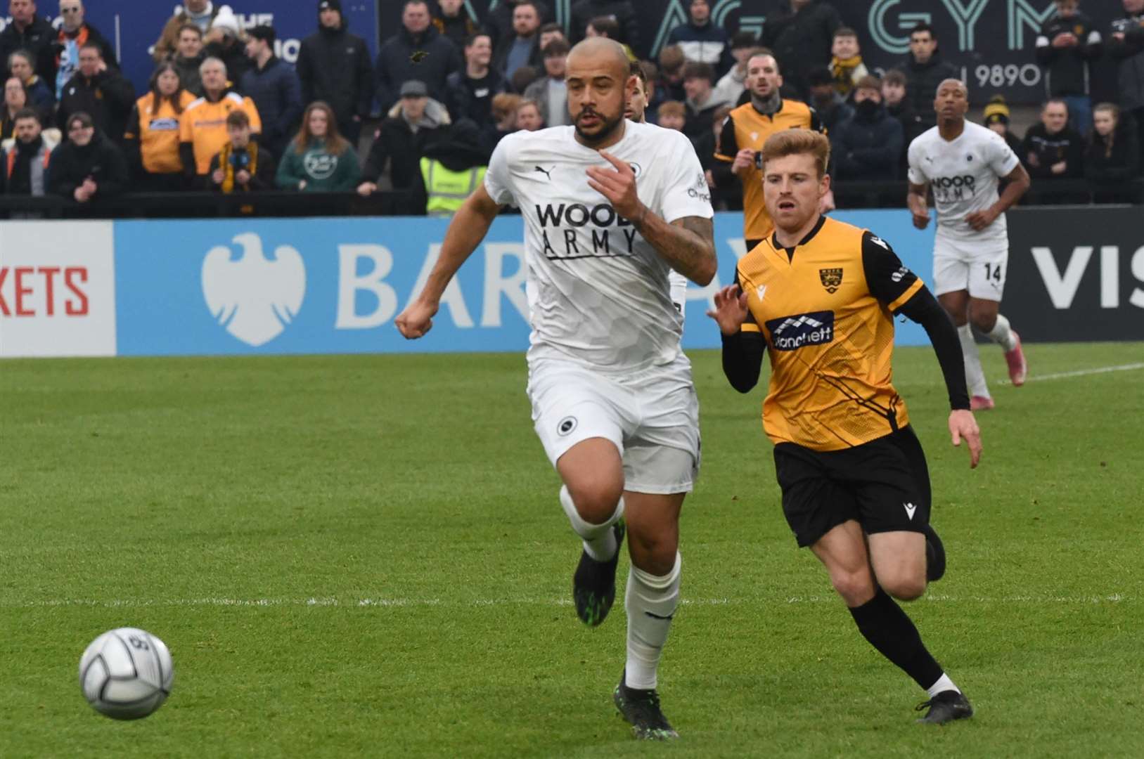 Jack Barham up against giant defender David Stephens in Maidstone's FA Trophy tie at Boreham Wood Picture: Steve Terrell