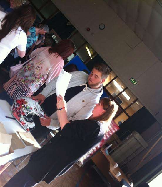 A pupil at Castle Community College in Deal checks his results over