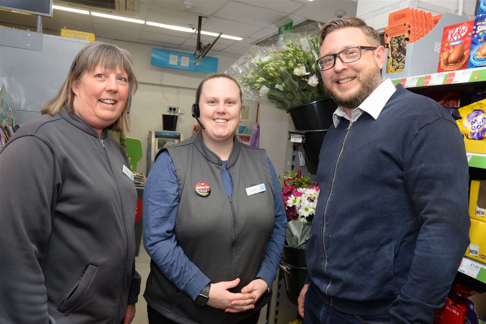 Co-op team member Sharon Trice and manager Laura Charles with Marc Harris