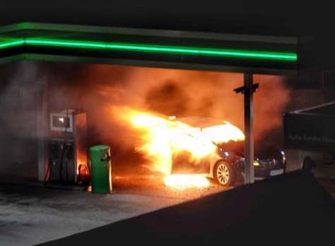 A car engulfed in flames at the BP garage. Picture: Ashley Judd