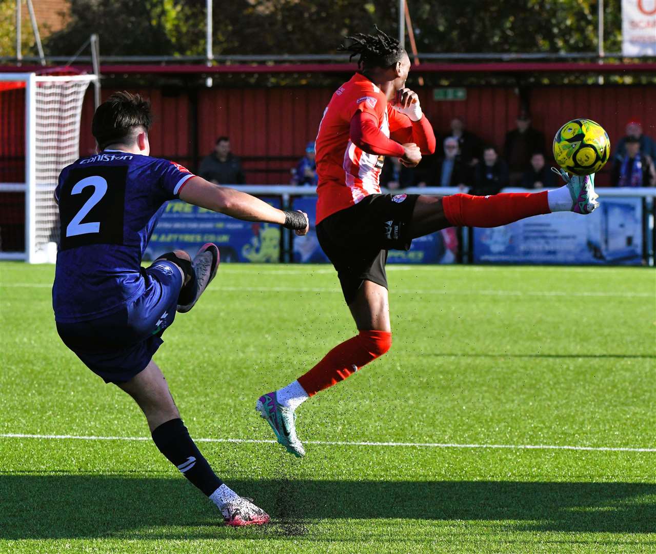 Sheppey's Gil Carvalho closes down a clearance by Margate defender Harrison Hatfull as Gate ran out 3-2 weekend winners at Holm Park. Picture: Marc Richards