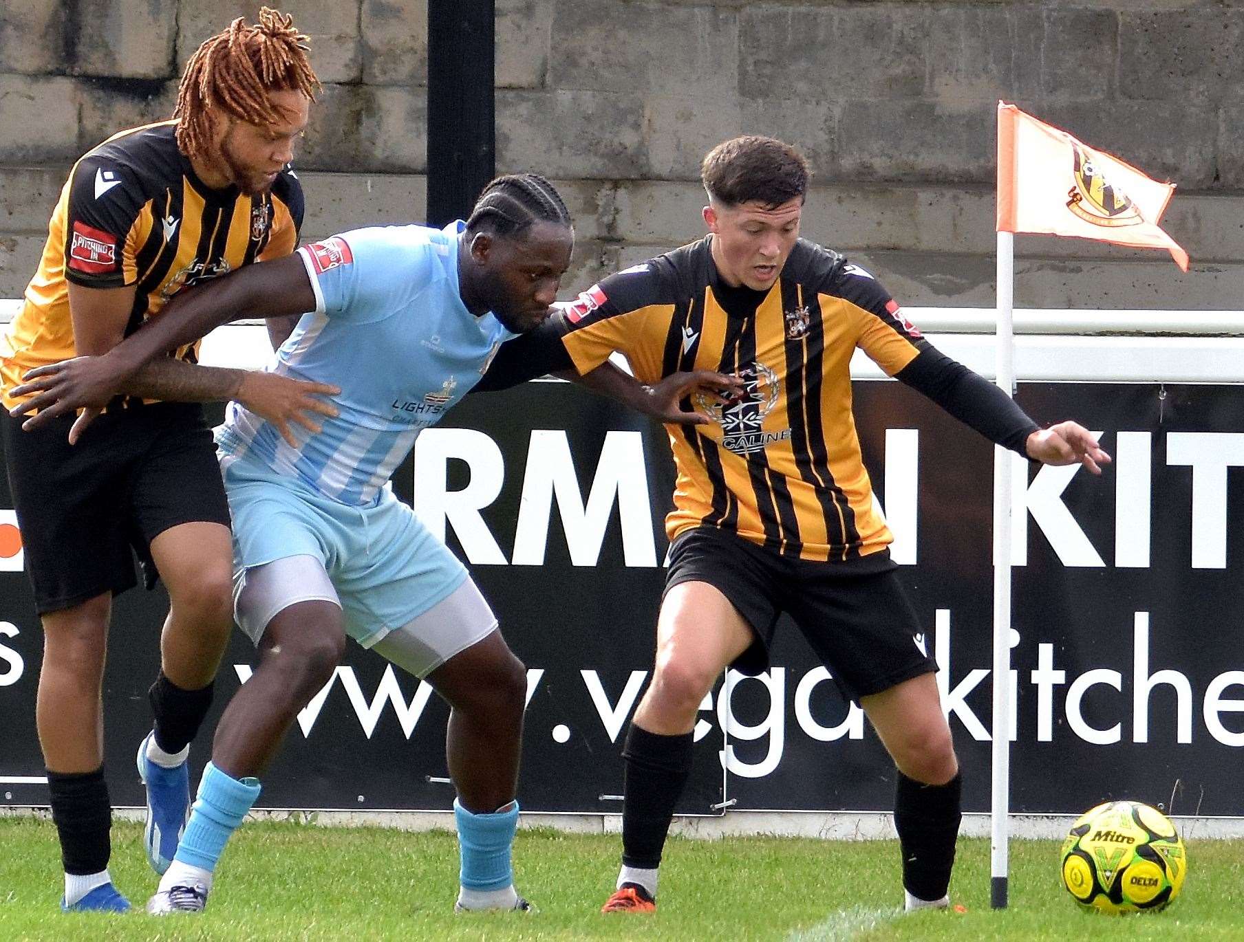 Folkestone pair Frankie Morgan and Peter Ojemen sandwich a Cray Valley player in Invicta’s controversial 1-0 Isthmian Premier defeat last Saturday. Picture: Randolph File