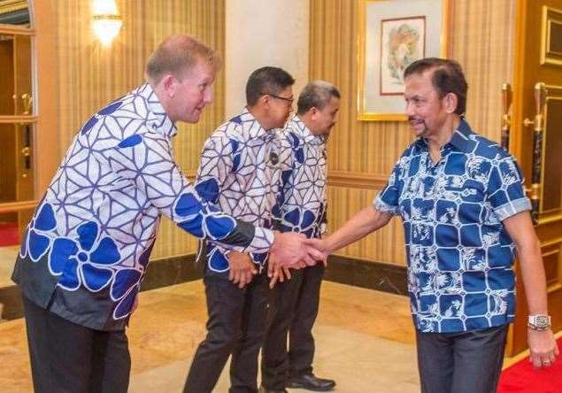 Ady Pennock meets the Sultan of Brunei after leading DPMM to the Singapore Premier League title in 2019