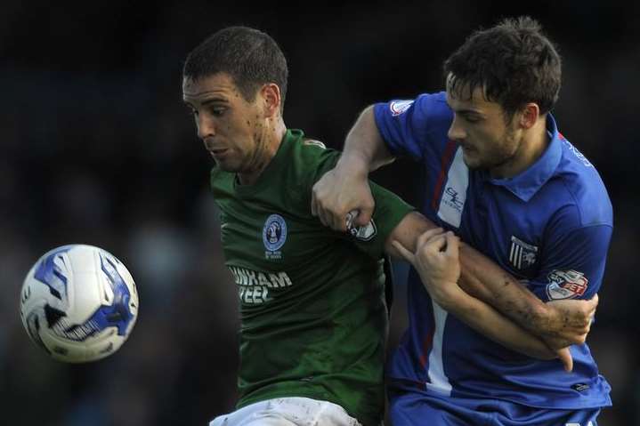 Josh Pritchard does battle with Scunthorpe's Sean McAllister Picture: Barry Goodwin