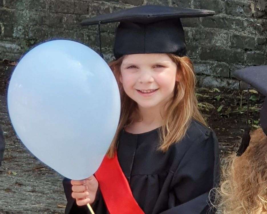 Gabriella White poses for her graduation photo