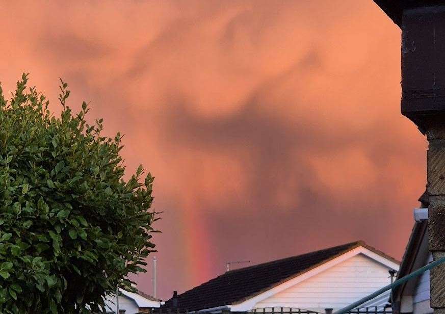 A rainbow poking through the red clouds was captured in Seasalter. Picture: Stacey Moon