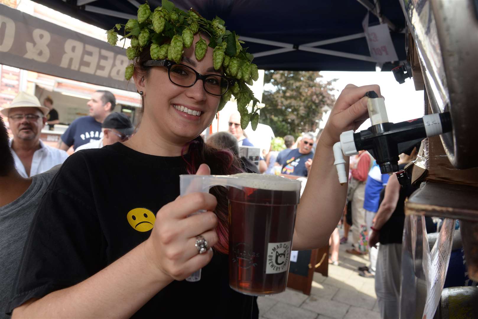 Christina Ketchum pulls a pint at Faversham Hop Festival in 2019. Picture: Chris Davey