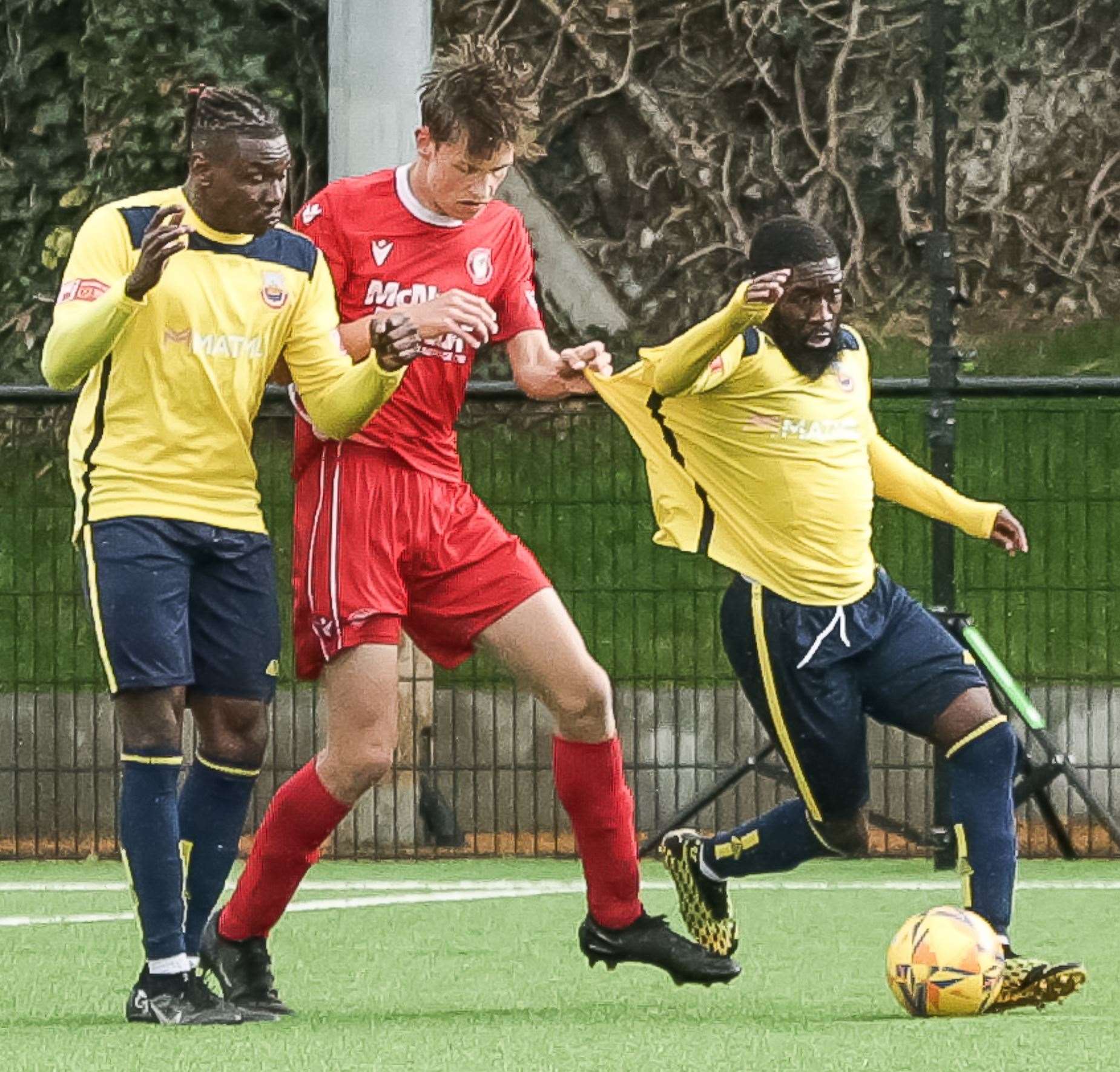 Hollands & Blair's Lewis Allan gets to grips with Whitstable's Jeffrey Oredein. Picture: Les Biggs