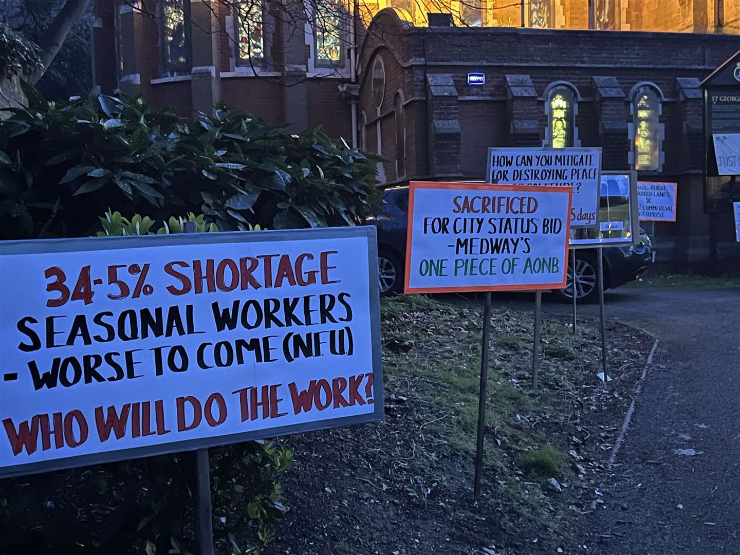 Signs outside Medway Council's planning committee meeting against plans for a £30 million winery in Upper Bush, Cuxton